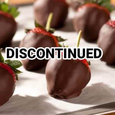 Dipped Strawberries are displayed on a tray with the word "DISCONTINUED" prominently shown over the image.