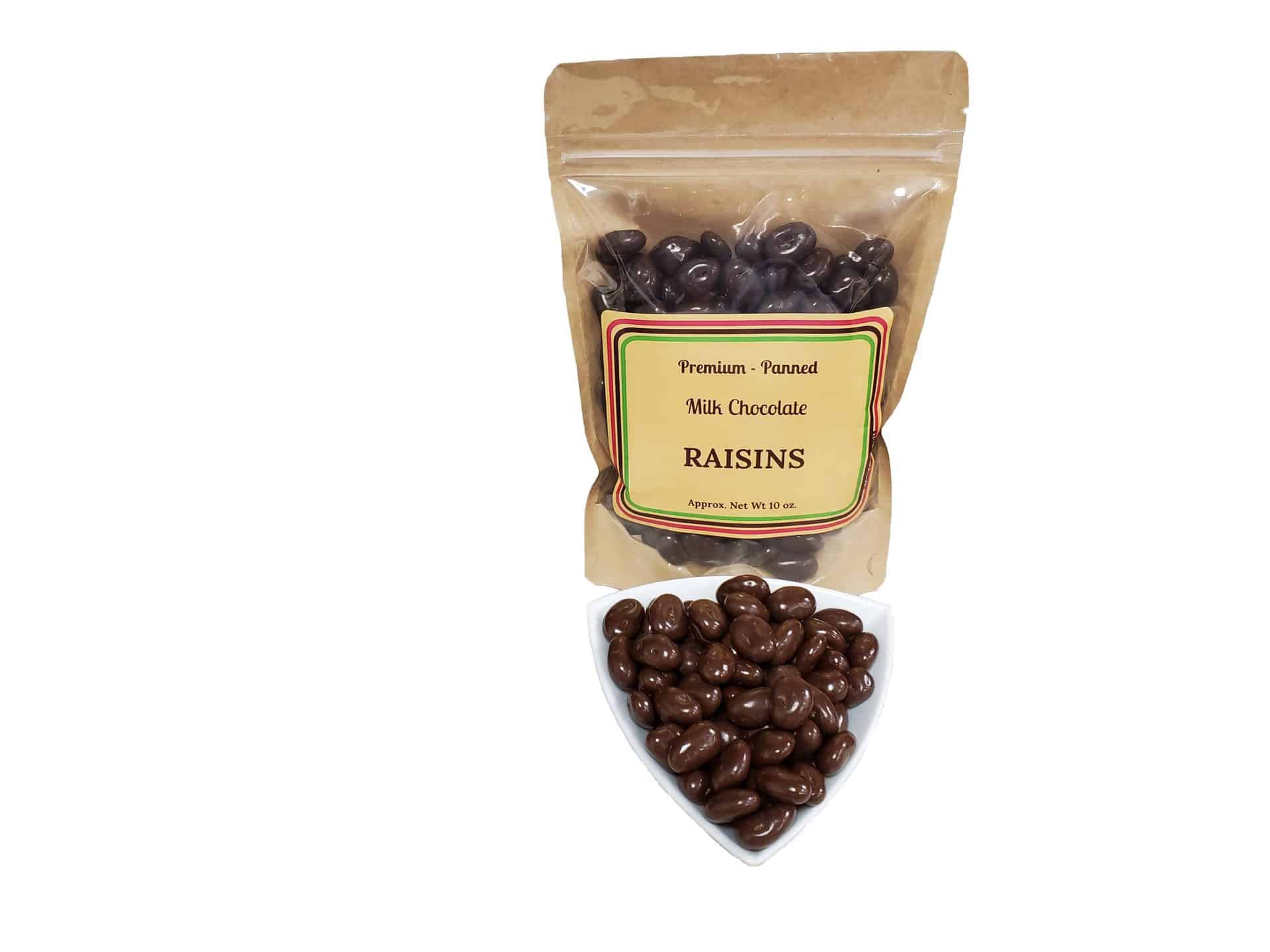 A bag labeled "Milk Chocolate Raisins" with chocolate-covered raisins inside, next to a small bowl filled with the same chocolate-covered raisins.