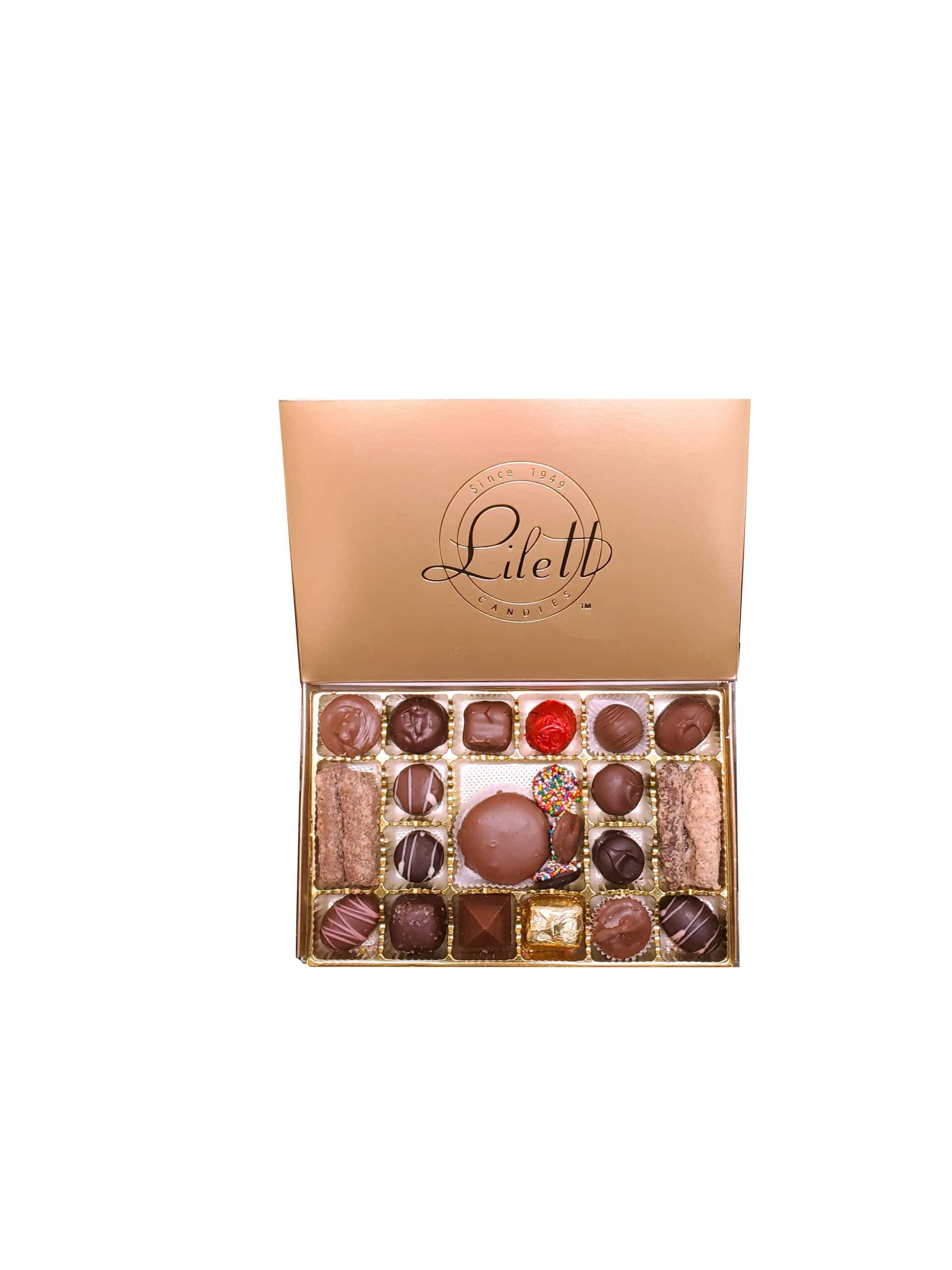 An open box of assorted chocolates with a gold lid displaying the brand name "Lilett." The box contains various shapes and types of chocolates and confections.